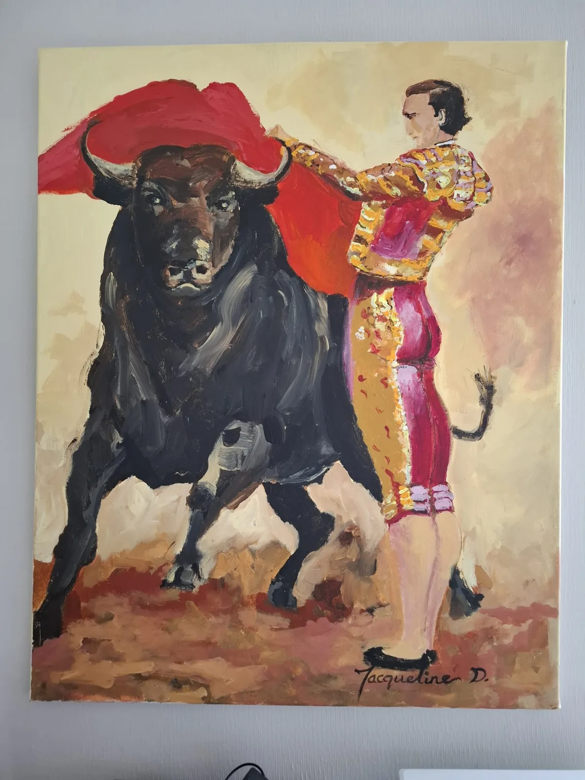 Zelfgeschilderd doek van een stierengevecht aan de muur